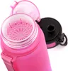 Close-up of the top of a pink and purple water bottle, showing the inside of the lid and the opening with a strainer. Produktbild-Vorschau