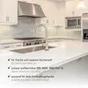 A modern kitchen with a sink, faucet, stove, and range hood, featuring overlaid text with product benefits. Produktbild-Vorschau