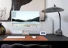 A desk setup with a computer, keyboard, mouse, and lamp. Náhled obrázku produktu