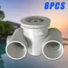 A product shot of pool jets with a blurred background of a building and water. Náhled obrázku produktu