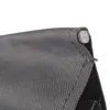 Close-up of a dark gray fabric corner with a metal rivet. Produktbild-Vorschau