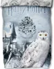 A close-up of a Harry Potter themed duvet cover set featuring Hogwarts castle, the Hogwarts crest, and Hedwig the owl. Produktbild-Vorschau