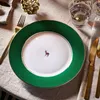 A table setting with a plate, cutlery, and a glass. Produktbild-Vorschau