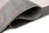 A close-up view of a folded rug, showing its texture and layered edges. Voir les images du produit