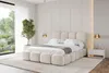 A modern bedroom with a large bed, a window overlooking a garden, and bedside tables. Produktbild-Vorschau