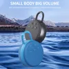 Two portable speakers are shown in front of a mountainous landscape and water. Produktbild-Vorschau