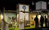 A trade show booth with bamboo structures displaying products. Podgląd zdjęcia produktu