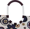 A close-up view of the handle and top portion of a patterned shopping bag. Podgląd zdjęcia produktu