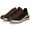 A pair of brown leather sneakers on a white background. Produktbild-Vorschau