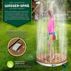 A young girl is playing in a garden with a circular outdoor shower. Náhľad obrázku produktu