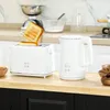 A white toaster and a white electric kettle are displayed on a wooden countertop in a kitchen setting. Podgląd zdjęcia produktu