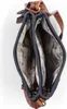 The image shows the inside of a blue handbag with brown leather accents. The lining has a patterned design. Produktbild-Vorschau