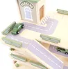 A close-up view of a wooden toy parking garage with cars. Produktbild-Vorschau