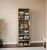 A tall, narrow shelving unit filled with folded clothes and a duffel bag, placed against a plain wall. Anteprima dell’immagine prodotto