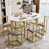 A dining table set with chairs in a modern dining room setting. Anteprima dell’immagine prodotto