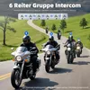 Motorcyclists riding on a road in a scenic, green landscape. Produktbild-Vorschau