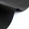 A close-up shot of a black, textured material, likely a grill mat, is shown draped and curved against a white background. Produktbild-Vorschau