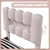 Close-up of a pink upholstered bed headboard with a graphic indicating adjustability. Produktbild-Vorschau