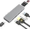A collection of electronic accessories, including a USB-C hub, USB drives, and memory cards, arranged on a white background. Produktbild-Vorschau
