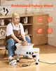 A woman is using a pottery wheel in a room with shelves of pottery. Podgląd zdjęcia produktu
