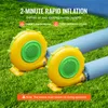 Two yellow and green blowers are shown on a grassy surface, connected to blue inflatable tubes. Voir les images du produit
