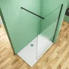 A modern shower enclosure with a glass wall and a white shower tray, set against a green wall and a wooden floor. Produktbild-Vorschau