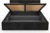A black upholstered bed frame with the mattress support lifted to reveal the storage compartment underneath. Produktbild-Vorschau