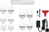 A collection of hair clipper accessories, including combs, guards, oil, and a charger, laid out on a white background. Produktbild-Vorschau