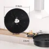 A close-up of a round charcoal filter for a range hood, with dimensions indicated. In the background, a kitchen scene with a stove and food is visible. Anteprima dell’immagine prodotto