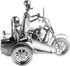 A metal figurine of a motorcycle with a sidecar and two figures. Anteprima dell’immagine prodotto