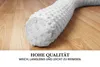 A close-up of a white, textured bolster pillow lying on a wooden floor. Produktbild-Vorschau