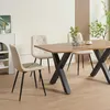 A dining room setting with a wooden table and chairs. Produktbild-Vorschau