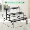 A black metal plant stand with three tiers, shown indoors with dimensions indicated. Produktbild-Vorschau