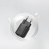 A black USB-C charger is shown inside a clear bubble against a light gray and white background. Produktbild-Vorschau