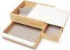 A jewelry box with multiple compartments and drawers, made of wood and white material. Voir les images du produit