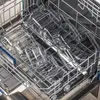 Glass food containers stacked in a dishwasher rack. Podgląd zdjęcia produktu