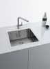 A modern stainless steel kitchen sink with a pull-out faucet, set against a clean white countertop and gray cabinet. Náhľad obrázku produktu
