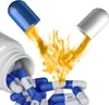 A white bottle of blue and white capsules is shown, with two capsules exploding into yellow powder. Produktbild-Vorschau