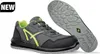 A pair of safety shoes, one shown from the side and the other from the sole. Anteprima dell’immagine prodotto