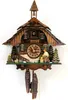 A traditional wooden cuckoo clock with carved details and figures. Anteprima dell’immagine prodotto