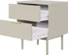 A neutral studio shot of a nightstand with two drawers, one of which is partially open, revealing its interior and drawer slides. The nightstand has a matte gray-beige finish and is supported by four slender legs. A thin, gold-colored handle adorns the fro Produktbild-Vorschau