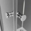 Close-up of two chrome handles on a glass shower door. Produktbild-Vorschau