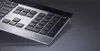 A close-up shot of a black and silver keyboard. Produktbild-Vorschau