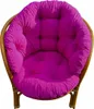 A close-up studio shot of a fuchsia cushion on a rattan chair. Produktbild-Vorschau