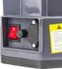 Close-up of a control panel on a gray device, showing a red on/off switch, a black dial, and a black connector with a warning label in Polish. Produktbild-Vorschau