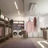 A laundry room with a ceiling-mounted clothes dryer, washing machines, shelves, and laundry basket. Náhľad obrázku produktu