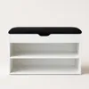 A white shoe cabinet with a black cushioned top, shown from the front against a white background. Produktbild-Vorschau