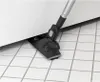 A vacuum cleaner head is shown cleaning under a white appliance on a tiled floor. Voir les images du produit