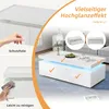 A living room scene featuring a white high-gloss coffee table with LED lighting and two drawers. The image also includes instructional graphics about protective film and cleaning. Voir les images du produit
