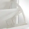 A close-up view of the internal mechanism of a white shoe cabinet. Produktbild-Vorschau